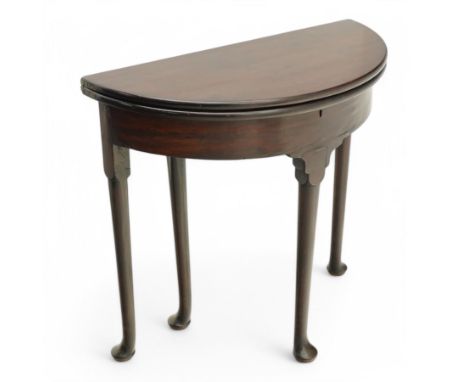 Mid-18th century mahogany demi-lune tea table, double hinged fold-over table revealing baize lined storage well, single gate-