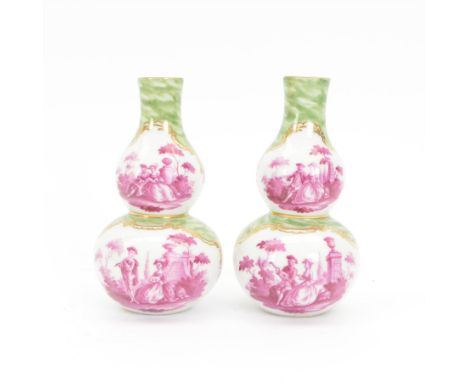 Pair of small late 19th century German double gourd vases, probably Dresden, each hand painted in puce with reserves of a cou