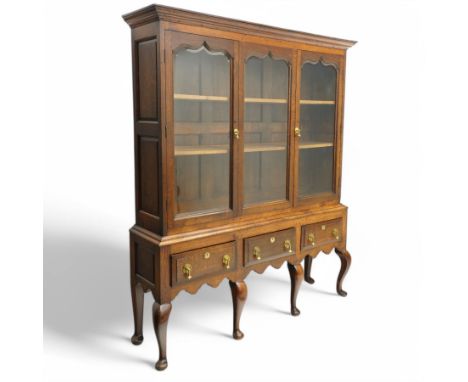 Georgian design oak and bevel glazed cabinet on stand, projecting moulded cornice over three pointed ogee arch window panes, 