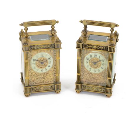 French - Matching pair of Edwardian 8-day timepiece carriage clocks with bevelled rectangular glass panels and overlaid friez