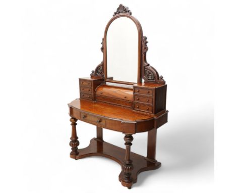 Victorian mahogany Duchess dressing table, D-shaped form with projecting corners and moulded top, the raised swing mirror in 