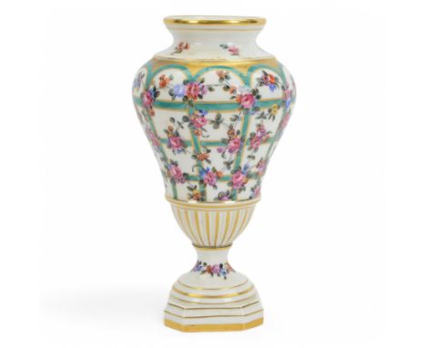 19th century Dresden pedestal vase, of baluster form, decorated with scrolling flowers upon gilt and green lattice work again