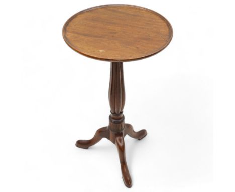 George III mahogany tripod wine table, circular dished top with moulded edge, bulbous lobe carved stem with triangular collar