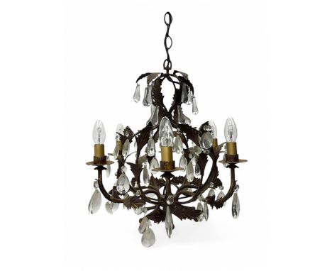 20th century distressed gilt tole chandelier, with six curved leaf clasped scrolling arms and frame, hung with lustre drops, 