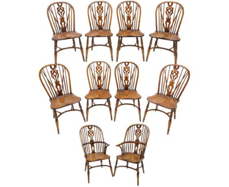 Set of ten (8+2) oak Windsor dining chairs, hoop and stick back with shaped and pierced splat, dished saddle seat on turned s