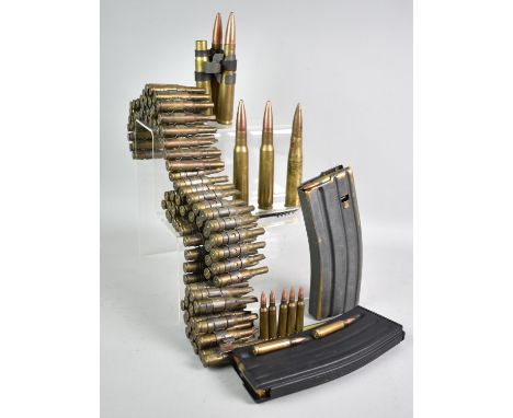 A Collection of Spent Ammunition to include Blank Machine Gun Belt, Shells, Bullet Clips Etc