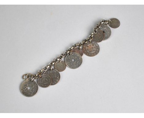 A Vintage Bracelet Signed for 'Monet, Jewelers' having Various Tokens and Coins Etc, 18cms Long