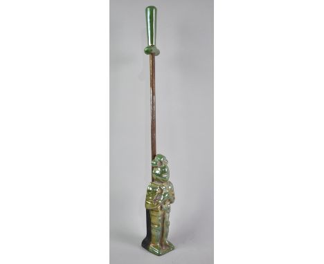 An Enamelled Cast Iron Poker Stand in the Form of Medieval Knight in Armour with Poker in the Form of a Sword