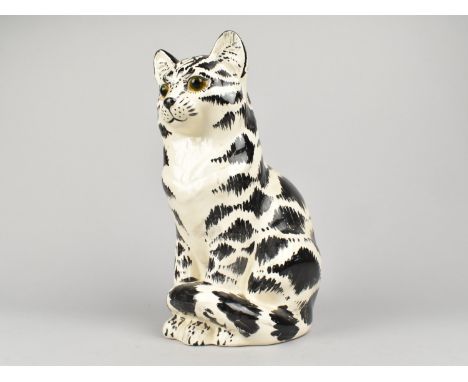 A Winstanley Style Cat with Glass Eyes, 27cm high