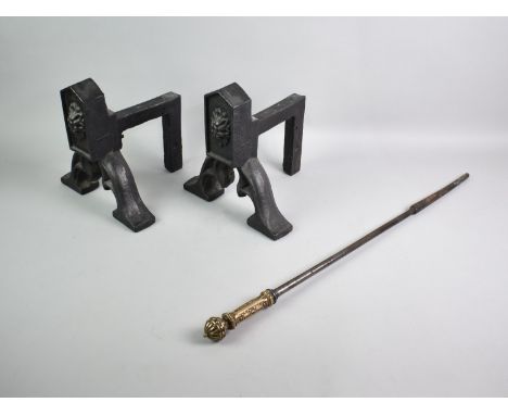 A Pair of Contemporary Cast Iron Fire Dogs and a Victorian Brass Handled Poker, Dogs 25cms High and 24ms Wide