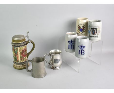 A Collection of Various German Stoneware Steins, Two Pewter Tankards and a Lidded German Lager Stein