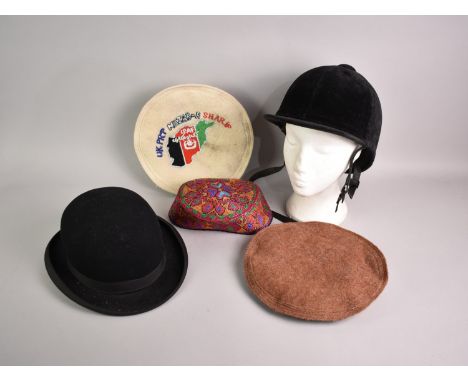 A Collection of Various Hats to include Bowler, Riding Hat, Two Afghanistan Berets, Pink Skull Cap