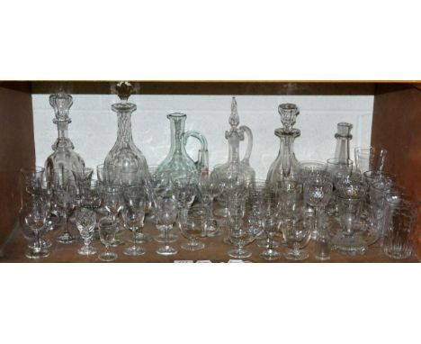 A shelf of glass including decanters, wines etc