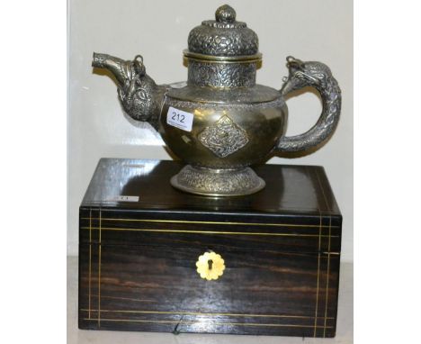An Indian white metal teapot 