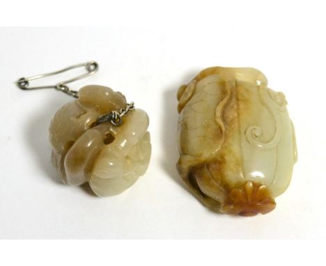A carved jade netsuke decorated with birds and a carved jade pebble in the form of a seed (2) 