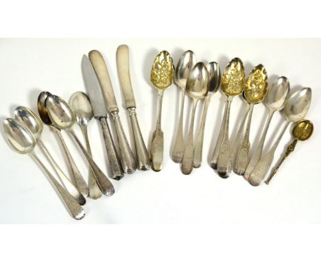 A group of sixteen various George III silver teaspoons, some small sets and pairs, together with a miniature anointing spoon,