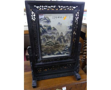 A contemporary Chinese pierced, ebonised, and porcelain inset table screen, 67 x 44.5cm