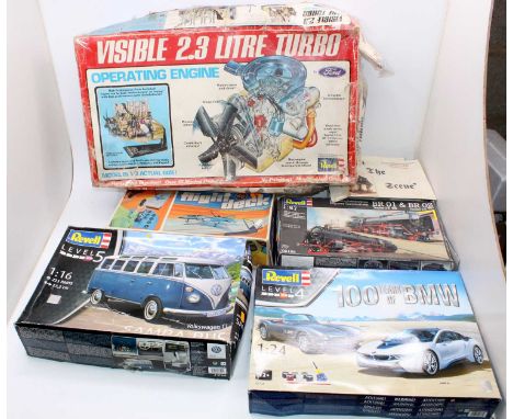 A collection of various model kits, with examples including a Revell 1/16th scale Volkswagen Camper Van, a 100 years of BMW 2