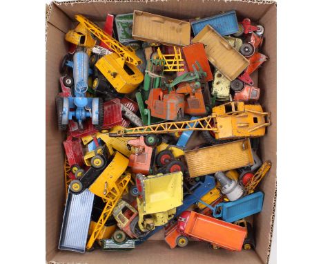 A tray containing a collection of play-worn Dinky Toys farming and construction models including a Muir Hill Dumper, a Coles 