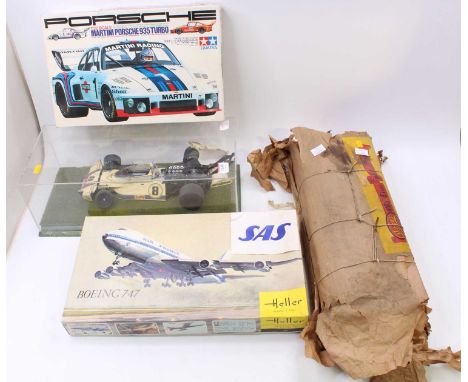 A collection of mixed media plastic and balsa wood kits to include a Heller Boeing 747 1/125 scale plastic aircraft kit, a Ho