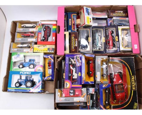 Three trays containing a quantity of boxed diecast to include Britains, ERTL Siku and others, specific examples to include a 