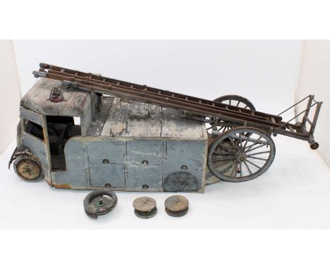 A wooden scratch built model of a Fire Engine with fire escape ladder, requires repair