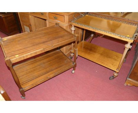 Two mid-20th century two-tier tea trolleys, each on roller castors