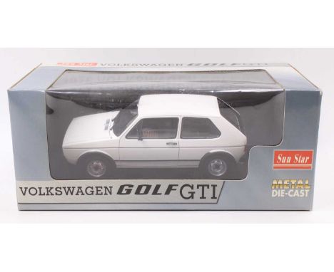 A Sun Star 1/18th scale No. 1091 Volkswagen Golf GTI in its original window box, the model has previously been on display