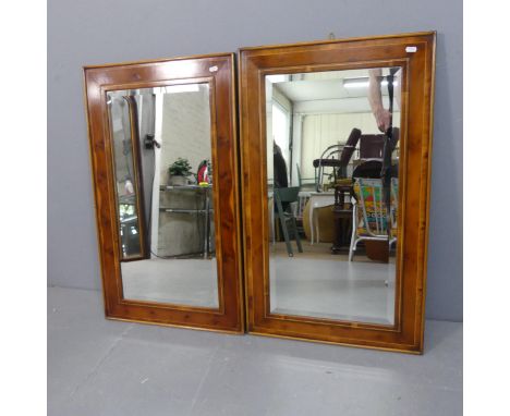 A pair of modern rectangular bevel-edged wall mirrors in yew-wood frames. Width 53cm, height 89cm.