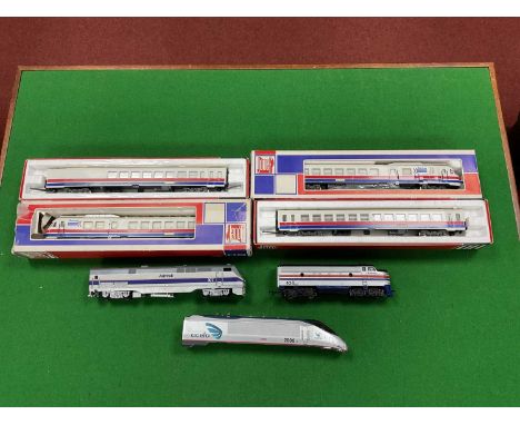 Two HO scale US Amtrak locomotives: a GE "Genesis" and an F7 "A" unit by Lifelike; together with a boxed Jouef four car "Turb
