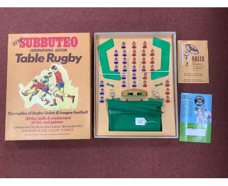 A Circa 1970 Subbuteo Table Rugby Intermational Edition. Comprising of Fifteen Players (each team), Two Kickers, Scrummer, Cl
