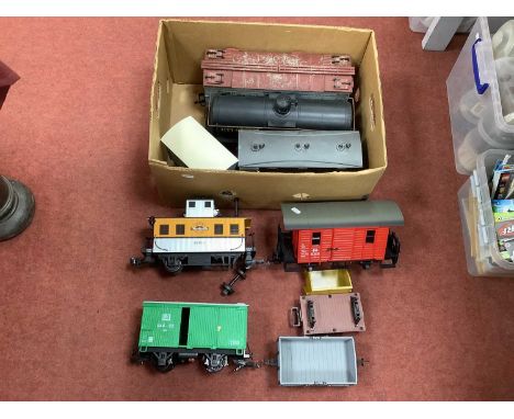 Nine Gauge One/10mm Unboxed Items of Rolling Stock by L.G.B, Bachmann etc, comprising a DR four wheel brake, box vans, ore wa