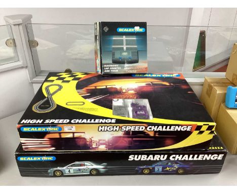 Two Scalextric 1:32 Scale Slot Car Sets comprising of #C1040 Subaru Challenge, TVR High Speed Challenge. Together with an Ele