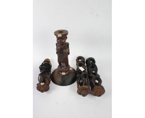 20th Century African tribal style floor lamp, made up of four pierced sections on a circular carved base, 151cm high&nbsp;