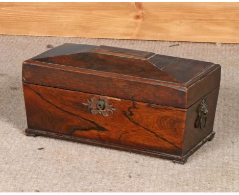 Victorian rosewood tea caddy, of sarcophagus form the hinged lid opening to reveal a central glass bowl and two compartments,