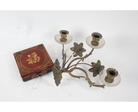 Brass wall mounted candle sconce, the three branches with glass drip pans interspersed with foliate decoration, 35cm wide, 20