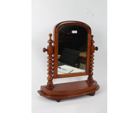 Victorian mahogany swing frame toilet mirror, raised on bobbin turned columns, 48cm wide