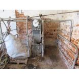 Two stall aluminium cow stalls with churn and pipework,