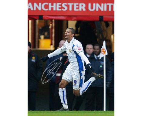 Autographed JERMAINE BECKFORD 16 x 12 Photo : Col, depicting Leeds United's JERMAINE BECKFORD running away in celebration aft