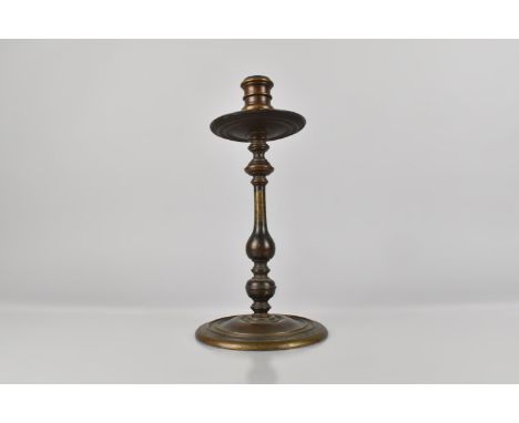 An Early 19th Century Continental Bronze Candlestick, 30cm high
