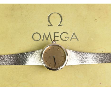 A 1970s Boxed Ladies Omega Mechanical Wrist Watch, Round Gold Face with Stick Hands and Hour Indicators, Case Measuring 22.4m