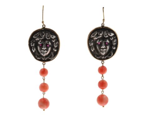 Gold and silver Medusa drop earrings w/ Ruby set eyes and Coral drops. Stamped on the hooks. Measure approx. 7.5 x 2.5cm. Gen