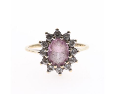 Clear and Pink Gemstone 9ct Gold Halo Dress Ring. UK ring size K. Stamped on the inside of the band. Weighs in total 2.1g