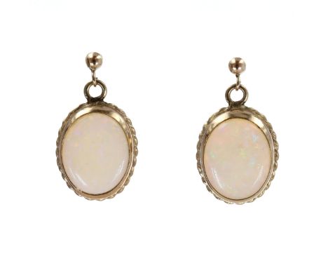 Pair of 9ct gold oval cabochon cut Opal drop earrings with posts. Stamped on the post. Measures approx. 2.5 x 1cm. Weighs 2.9