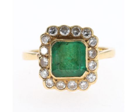 Emerald &amp; Diamond 18ct Gold Halo Ring. UK ring size K 1/2. Hallmarked on inner band. Weighs 4g. Slight chip to central be