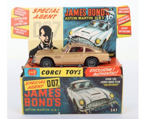 Corgi Toys 261 James Bond Aston Martin D.B.5 from the Film “Goldfinger” gold body, with ejector seat, rear bullet screen, ret