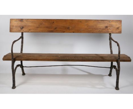 A 19th Century garden bench, possibly French, with naturalistic branch form ends, later back and seat, 178cm wide