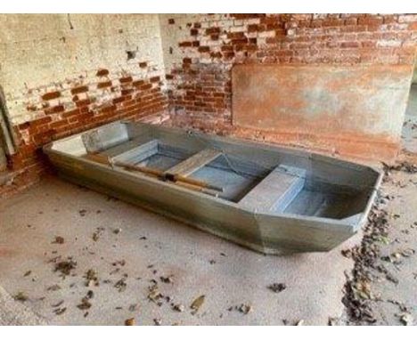 An aluminium johnboat, with three bench seats