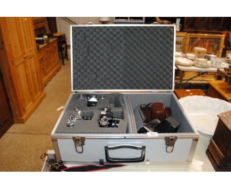 A Zenith-3 camera and a Zenit EM camera, and a Zenit-E camera etc. in camera case 