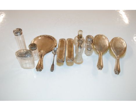 A quantity of silver backed dressing table items to include brushes, mirror, tidy jar and hat pin jar; various other silver m